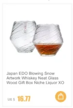 Set of hazy wine glasses with hammer pattern and snowflake design on a wooden table