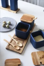 Ceramic kitchen storage container set with matte striped design and spoon