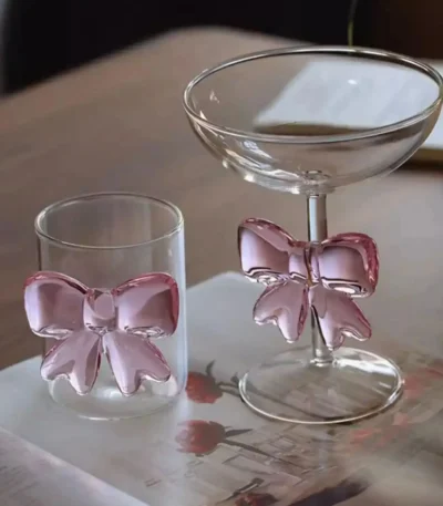 Elegant pink bow glass cup with heat-resistant borosilicate glass, perfect for champagne and cold drinks