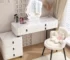 White modern vanity with stool featuring a large mirror and ample storage