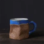 Japanese simple stoneware coffee cup on wooden table