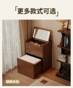 Wooden makeup vanity with mirror and stool in a modern bedroom setting