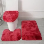 Plush bathroom rug set with toilet lid cover and mat in a cozy bathroom