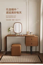 modern extendable dressing table with mirror and stool in a bedroom