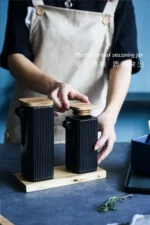 Ceramic kitchen storage container set with matte striped design and spoon