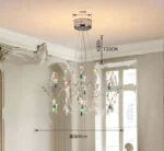 Modern stainless steel chandelier with crystal LED lights in a living room