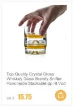 Set of hazy wine glasses with hammer pattern and snowflake design on a wooden table