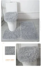 Plush bathroom rug set with toilet lid cover and mat in a modern bathroom
