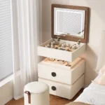 Modern lifting vanity table with mirror in cream finish, featuring rotating top and adjustable height for bedroom use