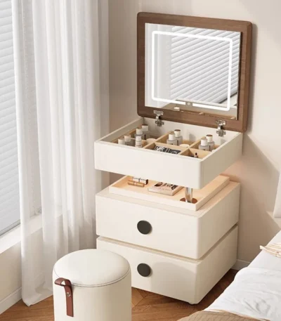 Modern lifting vanity table with mirror in cream finish, featuring rotating top and adjustable height for bedroom use