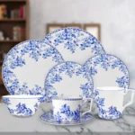 Vintage blue and white bone china dinnerware plate set on wooden table
