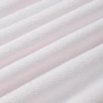 Ocean sunset pattern quick dry beach blanket on sandy beach with waves in background