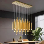 Brass finish mini pendant light with ribbed glass shade in a minimalist bedroom.