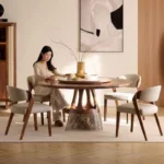 Round mobile dining table with caster wheels - space-saving solid wood table for small dining areas