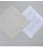 White linen cloth napkins hemstitched cocktail napkins set of 100 on wooden table