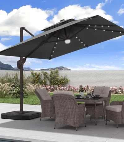 Goldoma large patio umbrella with lights illuminating a 9x9 FT square cantilever umbrella with solar LED lights in a bac
