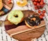 Round acacia cutting board with resin inlay on kitchen counter