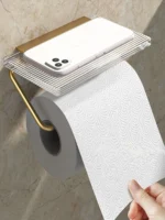 Aluminum alloy toilet paper holder with acrylic tray in a modern kitchen setting, holding a roll.