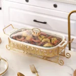Ceramic dinnerware set with lid and candle holder on a wooden table