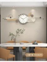 Clock in a hallway with a gallery wall, adding functional art to the space.