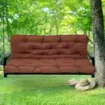 Outdoor bench cushion on a wooden garden bench with vibrant floral pattern