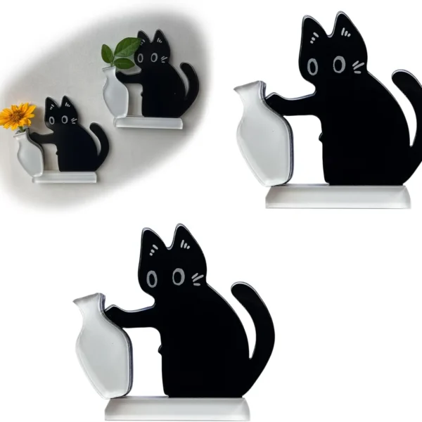 Black cat fridge magnet pushing a vase on a refrigerator door