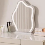 Modern wooden makeup vanity table with mirror and matching stool, featuring a storage drawer for organization