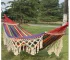 Bohemian double hammock with tassels in garden