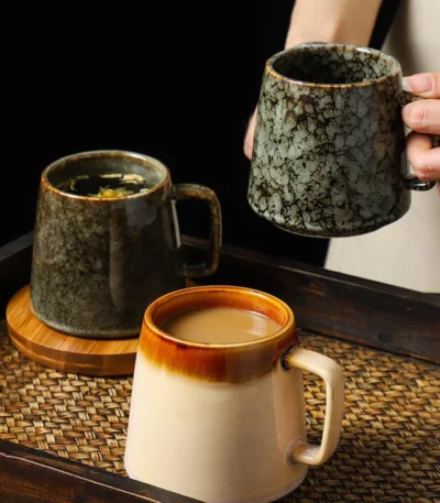 Vintage ceramic coffee mug with underglaze floral pattern on wooden table