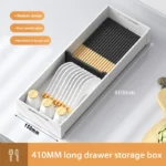 Kitchen drawer organizer with compartments for cutlery and utensils