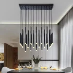 Black metal chandelier with six arms illuminating a cozy living room with beige sofa.