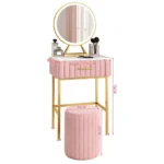 Marble top dressing table with lighted mirror and stool in a bedroom setting