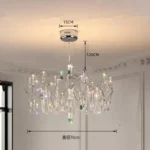 Modern stainless steel chandelier with crystal LED lights in a living room
