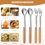 Stainless steel flatware set with wooden handles displayed on a table