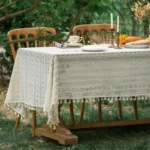 Retro polka dot tablecloth with fringe on a wooden table