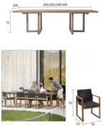 French retro oval dining table with natural wood top and teak base in a dining room setting