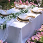 Boho cheesecloth table runner and napkins set as rustic table linens on a wooden table