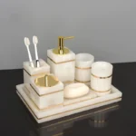 Toothbrush holder with marble base, golden top.