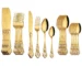 24-piece stainless steel cutlery set with gold handles displayed on a wooden table