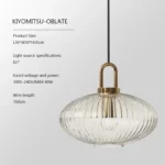 Japanese style pendant light in a bathroom, with the glass shade reflecting light on white tiles.