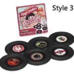 Set of vinyl record coasters on a wooden table