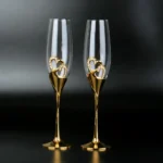 Elegant crystal champagne glasses set on a table with sparkling wine