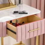 Marble top dressing table with lighted mirror and stool in a bedroom setting