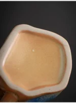 Japanese simple stoneware coffee cup on wooden table