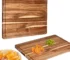 Extra large wood cutting board with juice groove and handles on kitchen counter