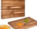 Extra large wood cutting board with juice groove and handles on kitchen counter
