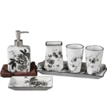 Chinese ceramic toothbrush holder with blue floral pattern, standing on a white bathroom counter.