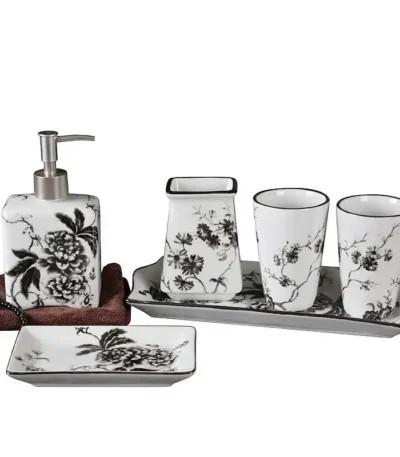 Chinese ceramic toothbrush holder with blue floral pattern, standing on a white bathroom counter.