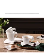 White porcelain espresso cup with wavy design on saucer, modern home decor