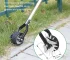 Goldoma manual lawn trimmer with sharp stainless steel blade, angled for precise cutting on green grass.
